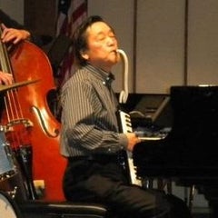 ジャズピアニカ田川康吉のプロフィール